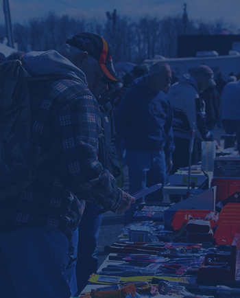 A patron browsing through a vendor's selection.